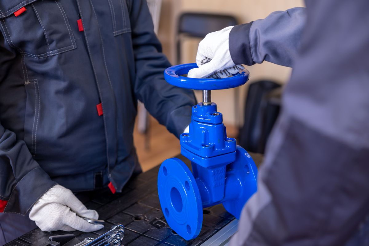 Technician inspecting equipment